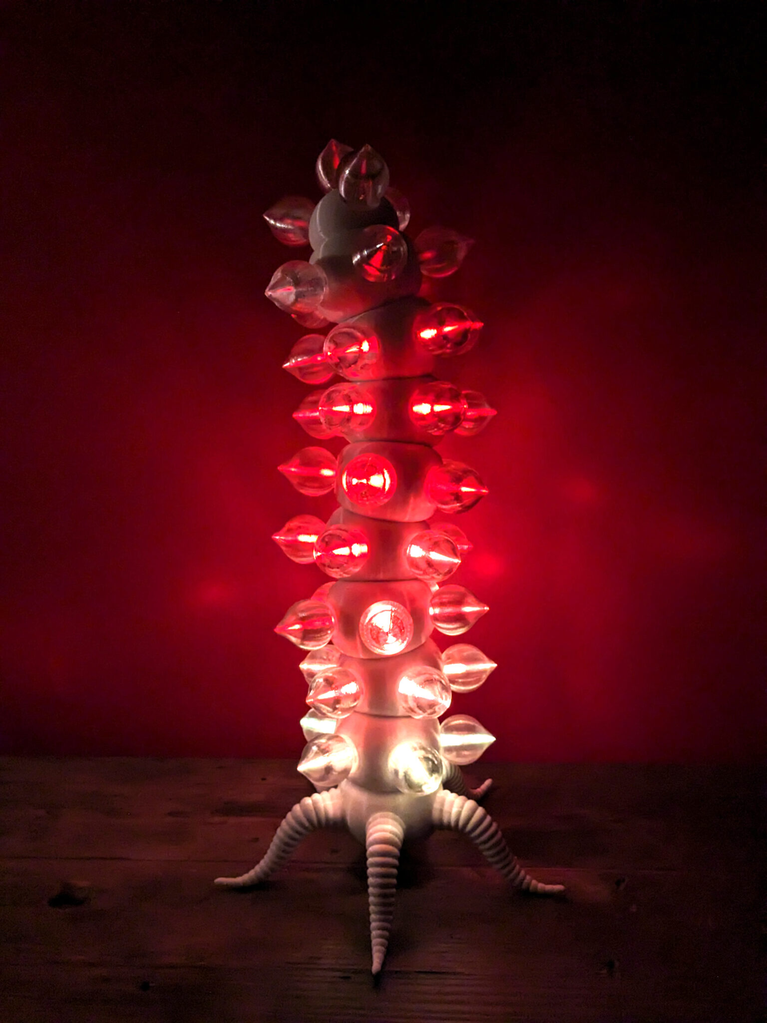 Fire-colored lights on the biomorphic light sculpture "Electric Fireworm"